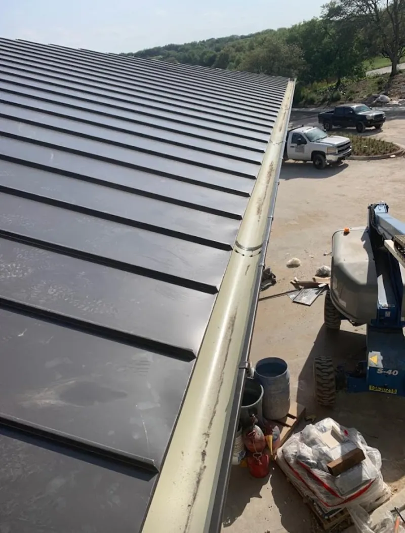 Standing seam panel and gutter detail on a metal roofing jobsite in South Euclid